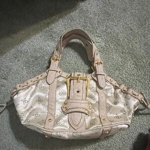 Handbag monogram with large gold buckle . Cream leather handle & suede lining.